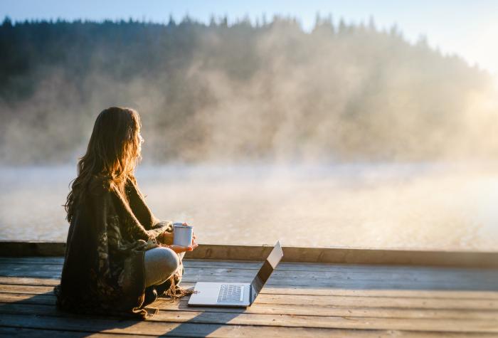 woman on dock with laptop